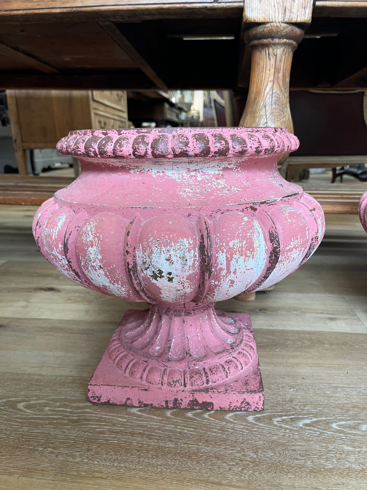 Pair of French Pink iron garden urns,