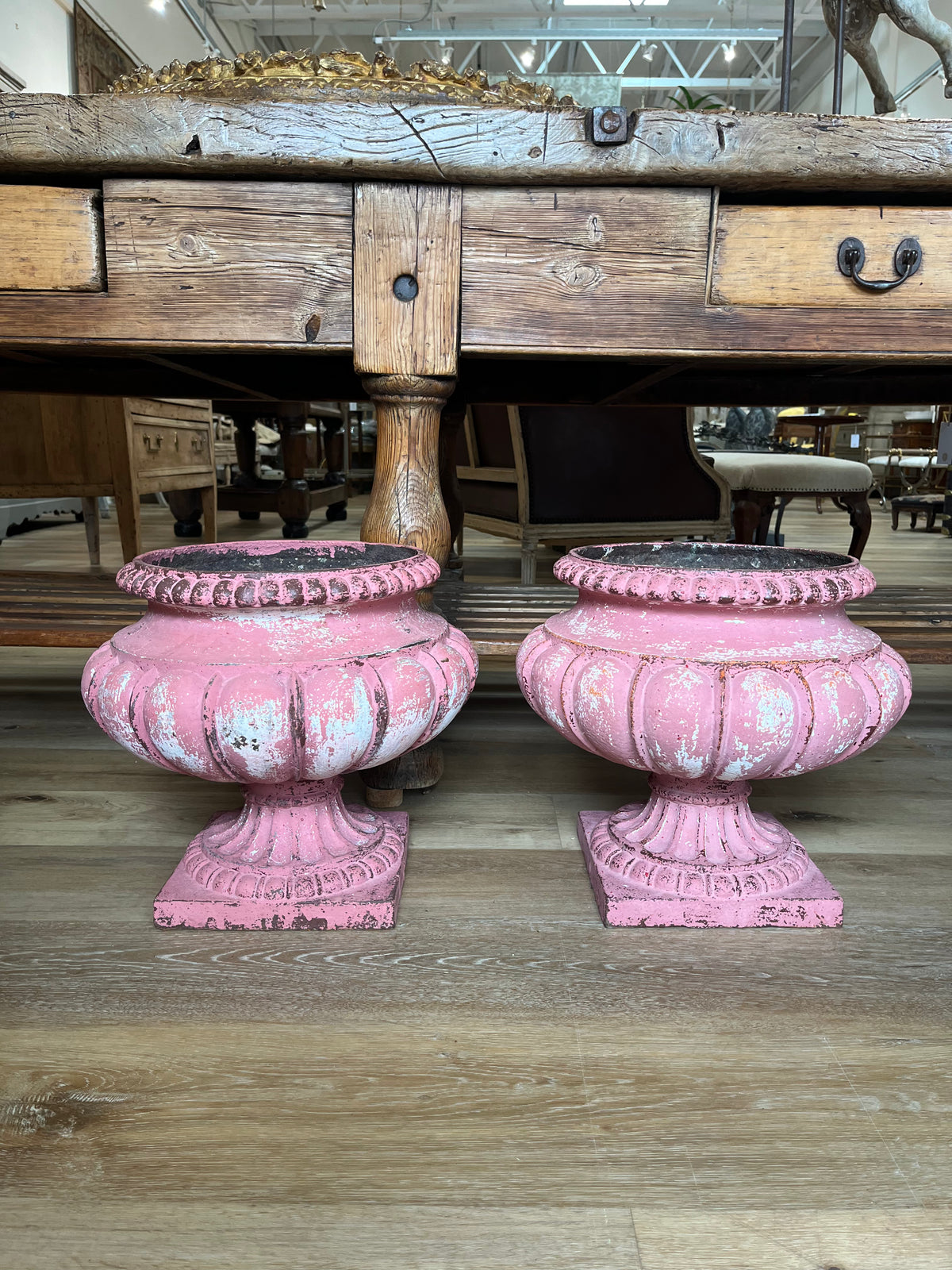 Pair of French Pink iron garden urns,