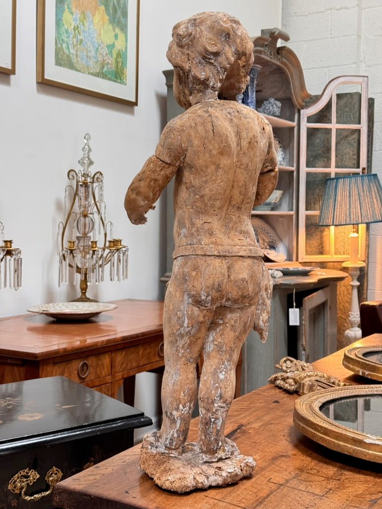 A Continental Carved Wood Putto, c. 1650 - Helen Storey Antiques