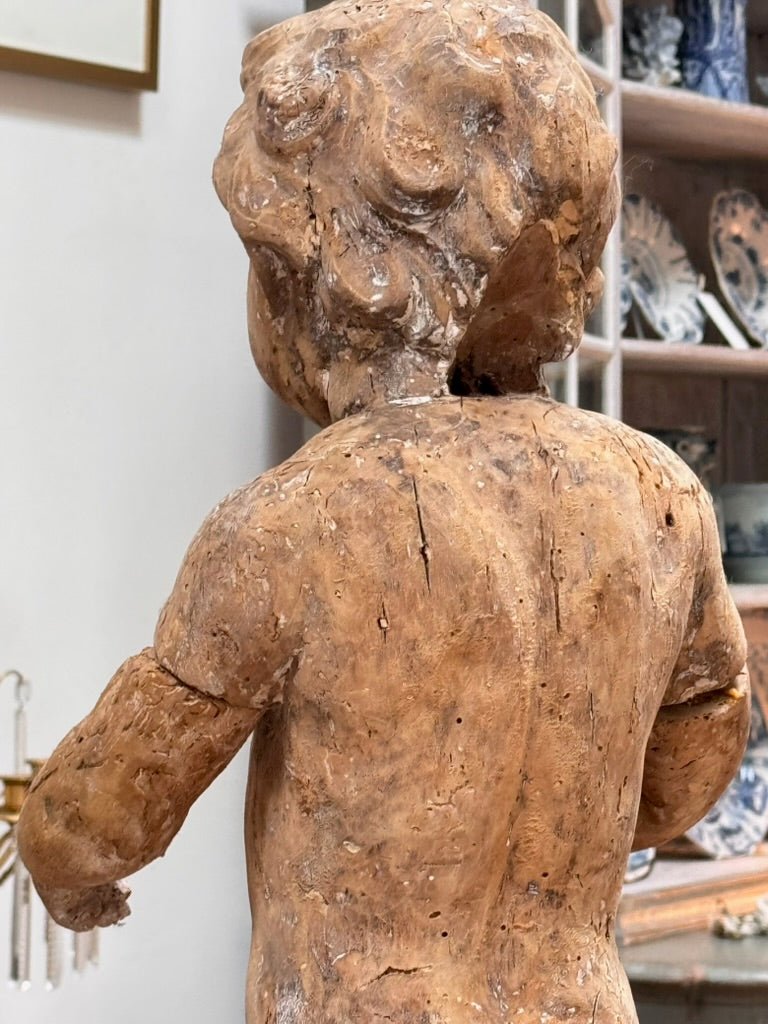 A Continental Carved Wood Putto, c. 1650 - Helen Storey Antiques