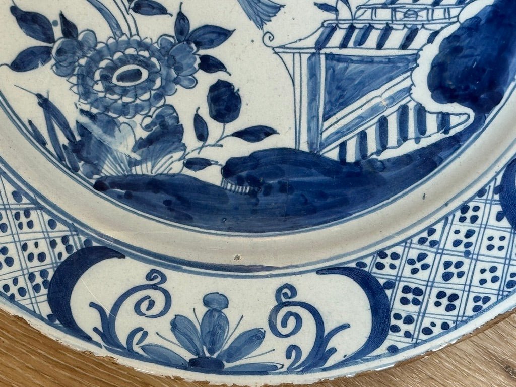 Fine English delft charger featuring a chinoiserie garden scene - Helen Storey Antiques
