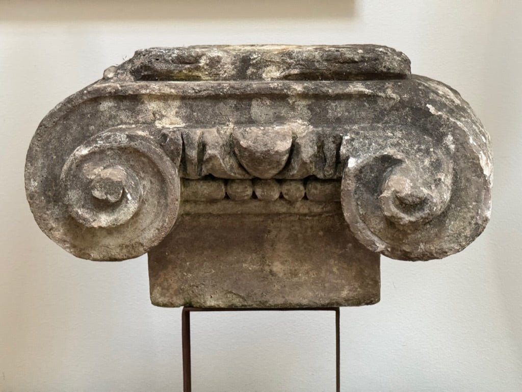 Ancient stone Ionic capital on an iron stand, French - Helen Storey Antiques